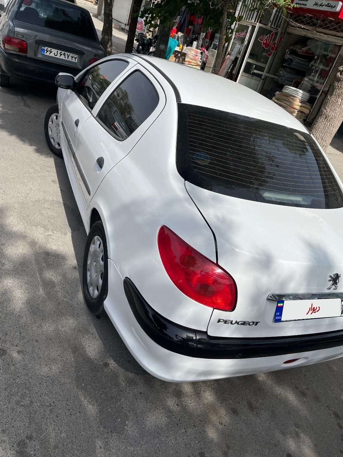 پژو ۲۰۶ صندوق دار v8 - 1396