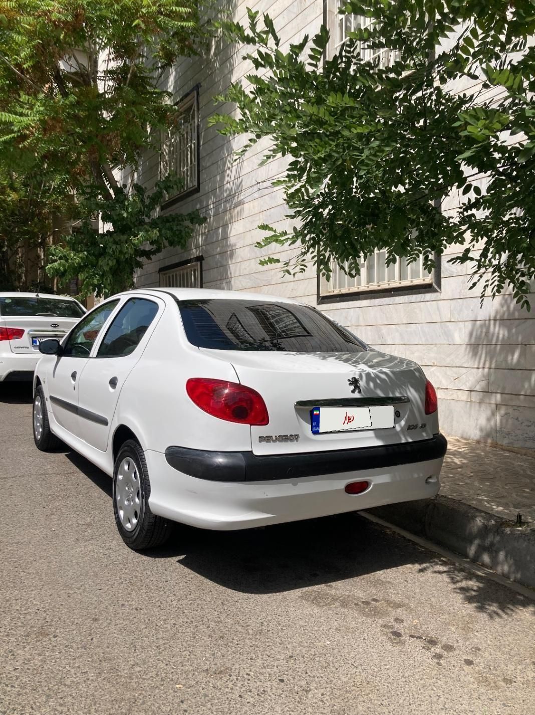 پژو ۲۰۶ صندوق دار v8 - 1396
